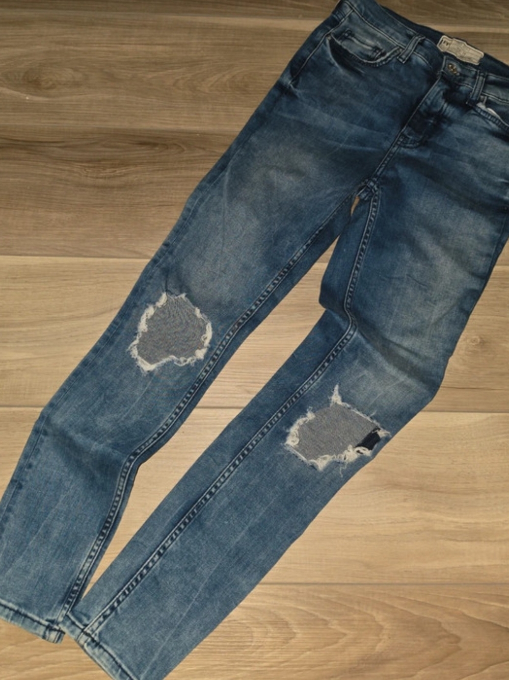 Free People Skinny Jeans in Washed Blue with Knee Rips